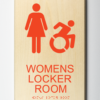 ADA compliant wooden sign showing womens locker room