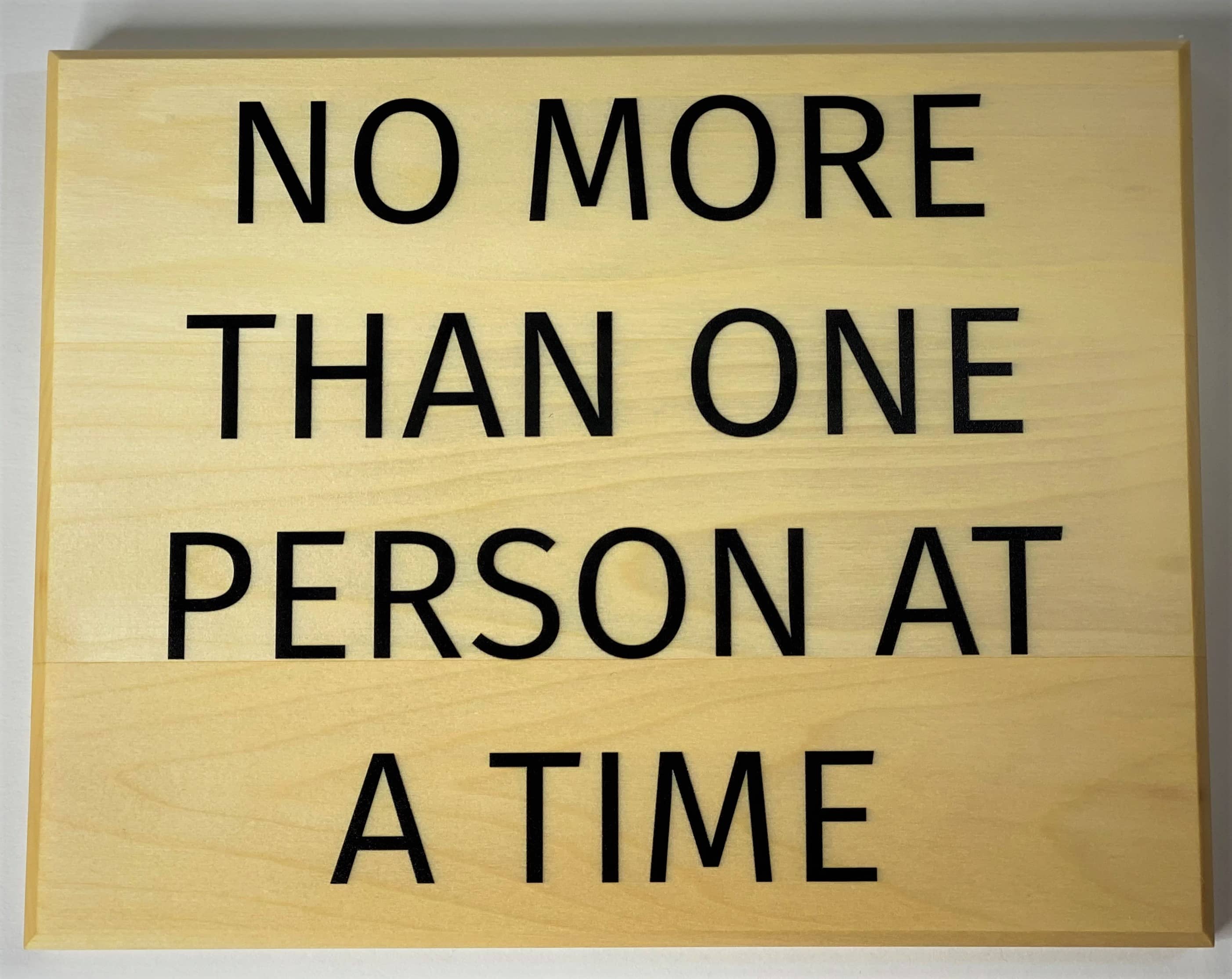 No more then one person at a time sign 