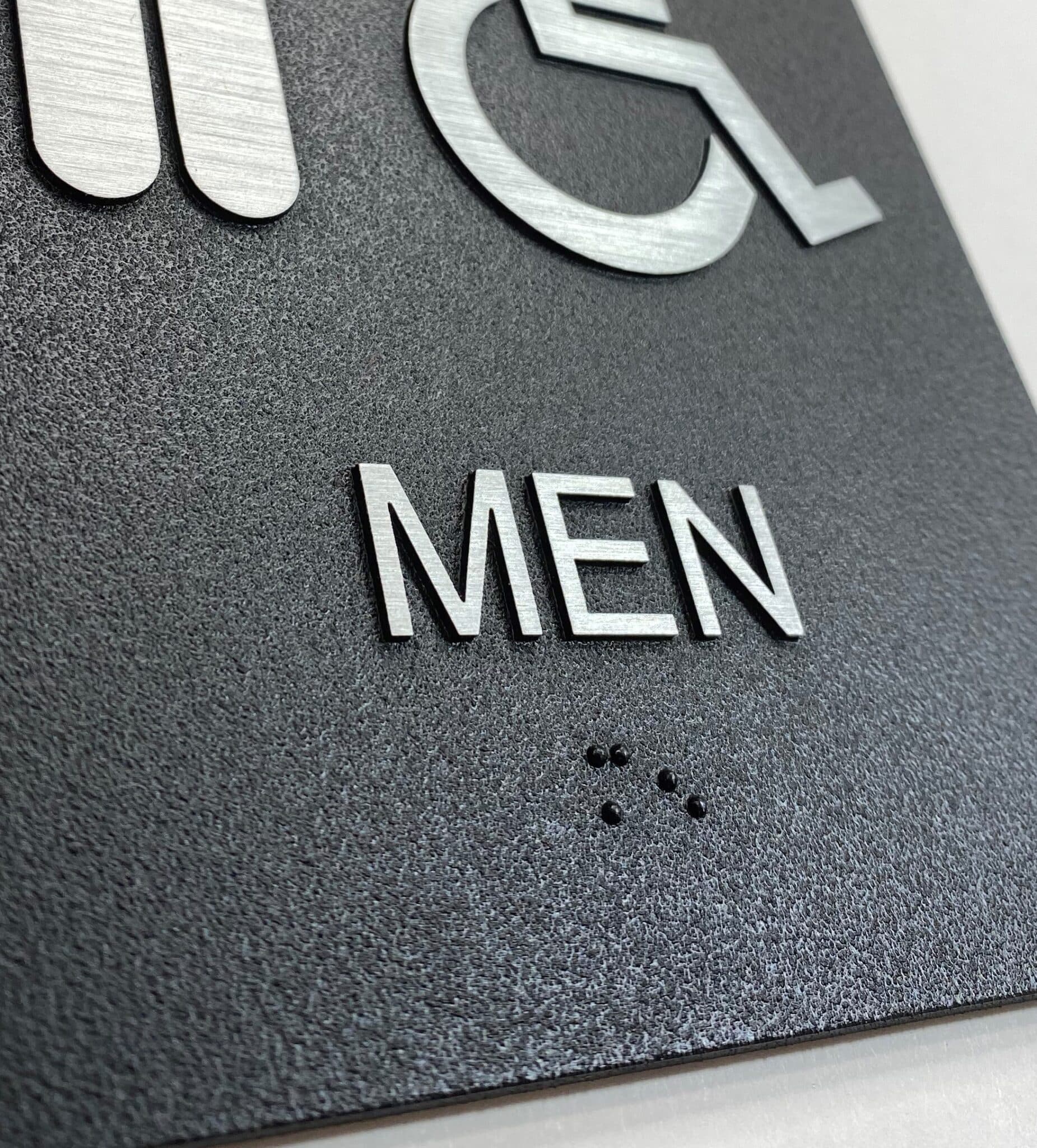 Exterior Mens Restroom Sign braille close up